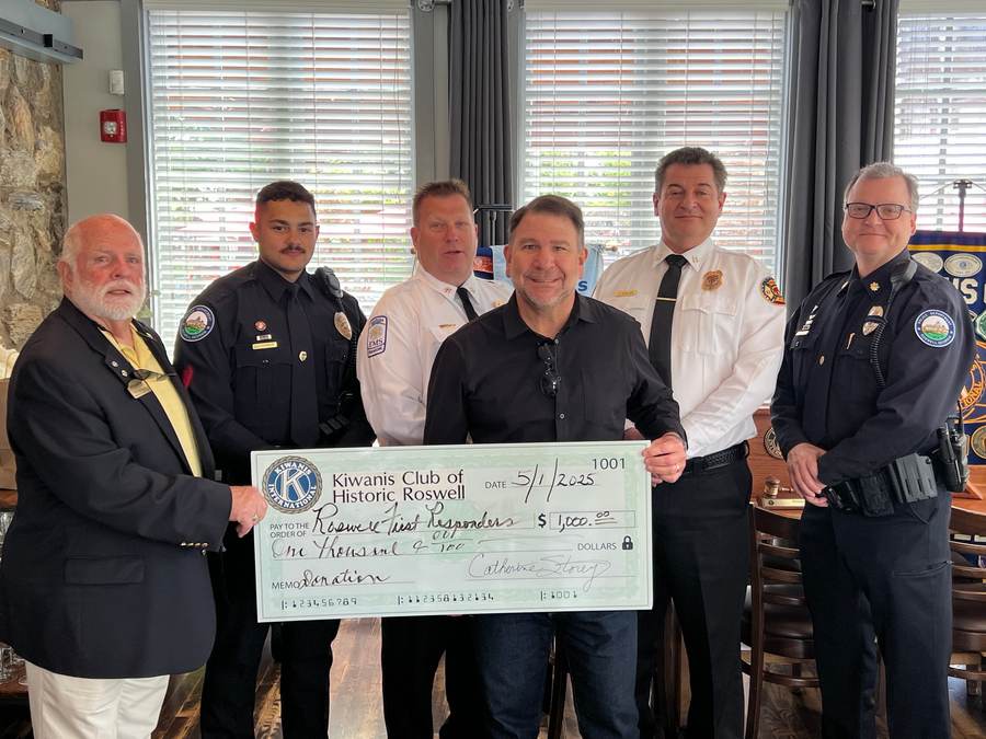 Roswell Police command staff receive a Kiwanis Club of Historic Roswell donation for RFRF.