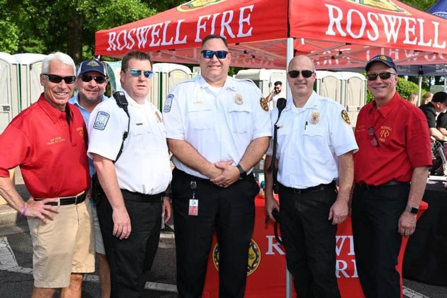 Roswell firefighters greeting families and neighbors at the Alive Roswell street festival.