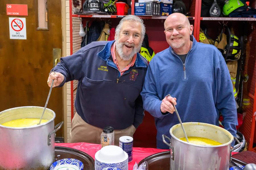 RFRF volunteers and first responders cooking together at a community fundraiser.